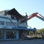 The digger making safe the building